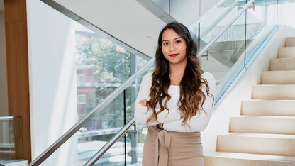 Kaylee Donjuan Mendoza smiles for a photo in Nebraska Business' Hawks Hall