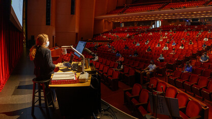 Trisha Vickrey, chemistry lecturer, leads a CHEM 251 class in the Lied Center for Performing Arts on Aug. 24. The Lied is being used as a lecture hall this fall to accommodate large numbers of students while still allowing for social distancing.