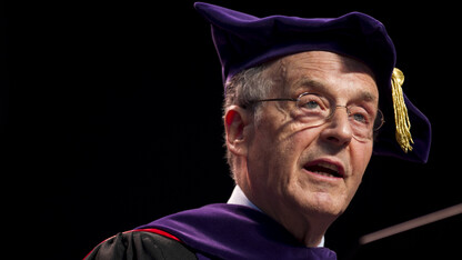 Chancellor Harvey Perlman talks during the Aug. 16 All-University Commencement at Pinnacle Bank Arena.