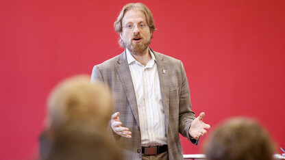 Gus Hurwitz, associate professor of law, Menard Director of the Nebraska Governance and Technology Center, and co-director of the Space, Cyber and Telecom Law program, leads a classroom discussion in photo taken prior to the global pandemic. The Nebraska Governance and Technology Center will begin offering in the fall a new tech governance curriculum open to all graduate students.