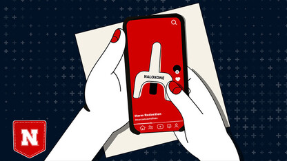 Two hands hold a phone with a graphic simulating a tiktok video about Narcan.