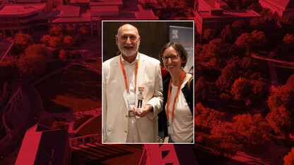 Paul Royster, coordinator of scholarly communications, here with Ann Connolly, was awarded the Digital Commons Lifetime Achievement Award, a bobble head figure of himself, at the Digital Commons Conference in Miami on Oct. 9. 