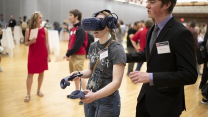 A student demos a VR project at the 2019 Senior Design Showcase.