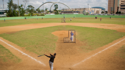 A shortstop takes batting practice at the Centro Olimpico baseball field in Santo Domingo.