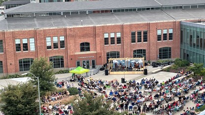 Nebraska Bluegrass Concert attendees enjoy a performance by The Steel Wheels in the NIC Plaza.