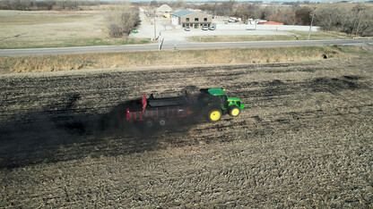 Biochar is applied to 16 acres of farmland in northeast Lincoln with a manure spreader during University of Nebraska–Lincoln research trials in April.