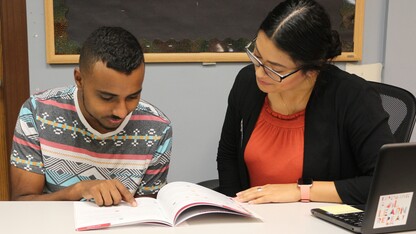 Career Advisor Letty Garcia helps a student develop his resume.