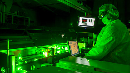 A scientist works with lasers in the Diocles Extreme Light Laboratory.