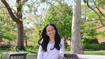 Courtesy photo // Xin May Kok— an integrated media communications graduate student from Banting, Selangor, Malaysia — poses for a photo on benches near Canfield.