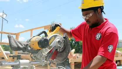 An AmeriCorps member works on a project in Omaha.