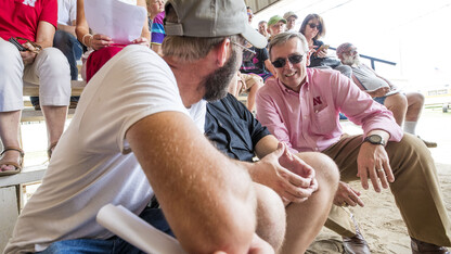 .Spectators at the Fillmore County Fair talk with Chancellor Ronnie Green during his June 13 trip to three counties in southeastern Nebraska.