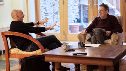 Paul Barnes (left) visits with composer Philip Glass in New York in January.