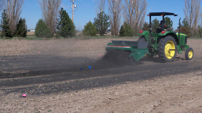 Char is spread onto research plots at the Mitchell Agriculture Lab, which is located north of the University of Nebraska Panhandle Research and Extension Center. Grant funds are available to assist the development of biochar in Nebraska and Kansas.