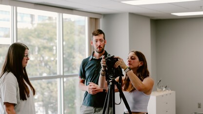 Students working with a professional in residence