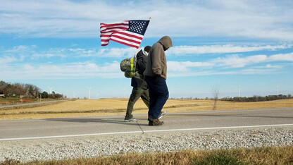 Volunteers on team Nebraska walk a stretch of highway as part of the veteran suicide awareness ruck march to Iowa City.