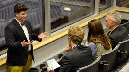 Sam Meier, a junior management and marketing major from Heartland, Wis., pitches his business idea for TattooMi at the 3-2-1 Quick Pitch competition on Nov. 21, 2013. 