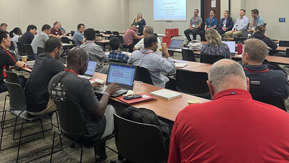 Individuals sitting at tables while taking part in a NUtech Ventures entrepreneurship workshop.