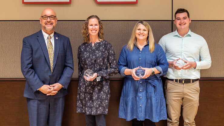 Mike Boehm, Harlan Vice Chancellor of IANR (from left), presents the Omtvedt Innovation Team award to the Cultivate ACCESS team members Leah Sandall, Julie Bray-Obermeyer and Logan Newman. 