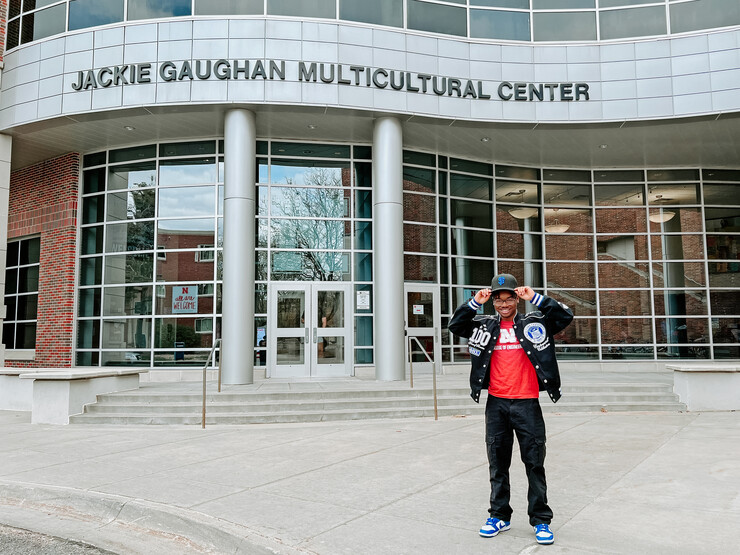 Tharpe III poses in front of the Jackie Gaughan Multicultural Center.