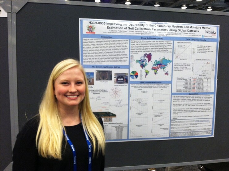 Catie Finkenbiner with her award-winning poster at the American Geophysical Union fall meeting. (Photo courtesy Catie Finkenbiner)