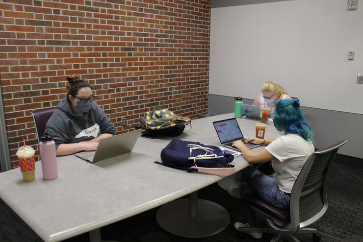 Students studying and working in the Adele Hall Learning  Commons
