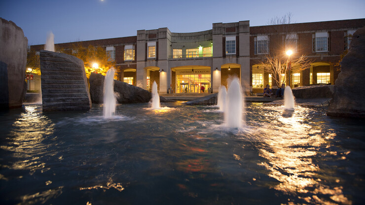 The modern design of UNL's Broyhill Fountain at night.