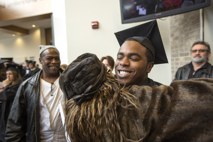Ronnie Buggs of Omaha is congratulated following commencement.
