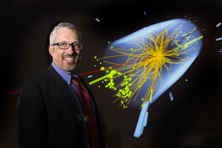 UNL physicist Aaron Dominguez leads collaboration involving eight universities to upgrade the Compact Muon Solenoid particle detector, a key component of the world’s largest physics experiment. The illustration shows an event, captured by CMS in 2012, that provides evidence of the Higgs boson.