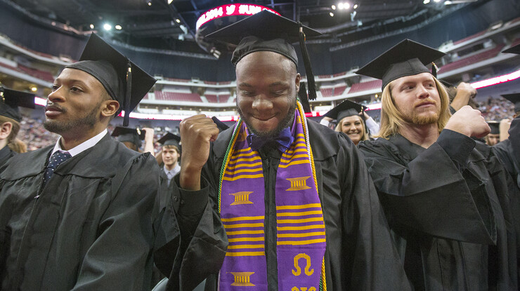 Nick Banks reacts after UNL graduates moved tassels on their mortar boards during winter commencement exercises on Dec. 20, 2014. A recent UNL focus on improving retention rates for all students is among factors that helped the university become a national leader in improving graduation rates for all students, including those from underrepresented groups.