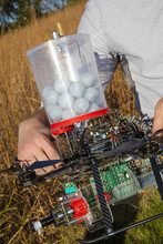 A new drone developed by UNL researchers can carry specialized plastic spheres that can be used to reduce the dangers associated with setting range fires.