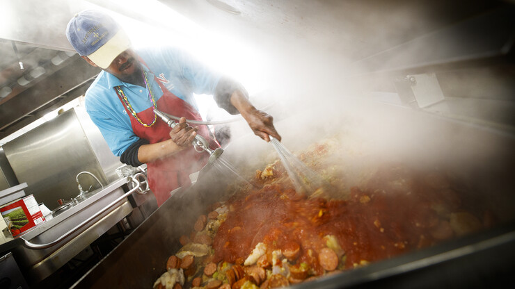 University Housing chef Ron White makes seafood jambalaya for a Fat Tuesday meal in the East Campus Dining Hall. Food week stories will include a by the numbers exploring the amount of food served in campus dining centers.