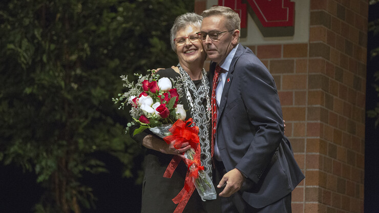 Chancellor Ronnie Green congratulates Chris Jackson for her 17 years of service as Nebraska's vice chancellor for business and finance. Jackson has announced plans to retire in December.