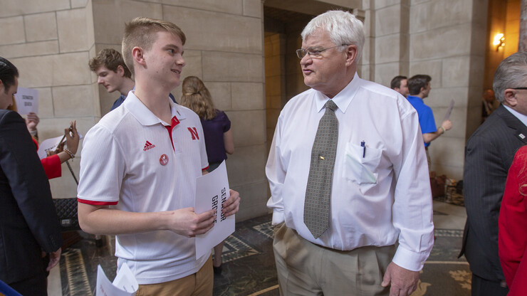 Sophomore Zak Folchert talks with Sen. Mike Groene as part of the "I Love NU" Advocacy Day on March 27. Folchert attended the event as a representative of the Association of Students of the University of Nebraska.