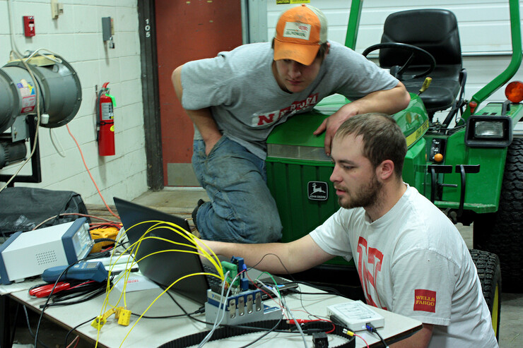 Members of the Quarter-Scale Tractor Team use the latest Computer Aided Design technology to design their award winning tractors.