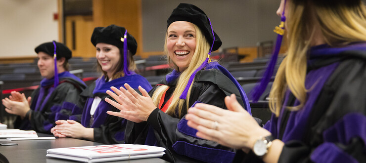 Cecily Sweet of Lincoln applauds with other graduates during the College of Law commencement ceremony Dec. 18 at Ross McCollum Hall. She received her juris doctor and a master of business administration degree on Dec. 18.