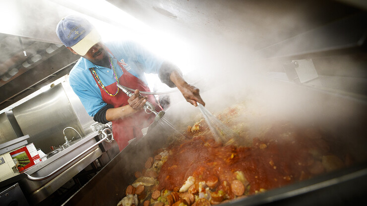 Chef Ron White makes his seafood jambalaya steam while cooking a batch in February 2017 at the East Campus Union Café and Grill. White is among the 500-plus people who work for the University Dining Service.