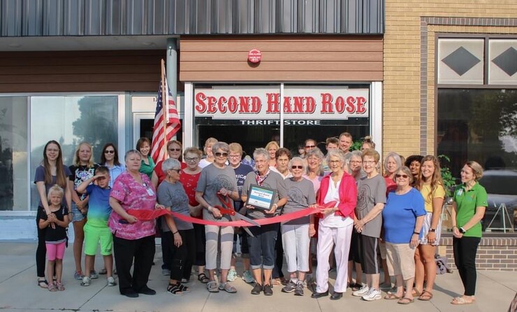 Rural Fellows Clare Umutoni and Kaylee Burnside celebrate the ribbon cutting of Second Hand Rose’s new storefront with Ord’s Chamber of Commerce. This was one of many such openings they celebrated this summer.