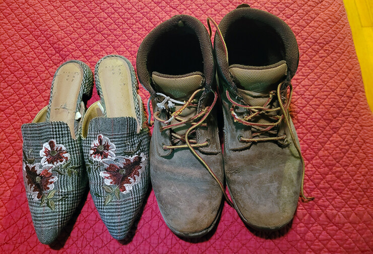 A photo of Jolene Meyer's shoes, encapsulating her two personalities on campus (right) and at home (left).
