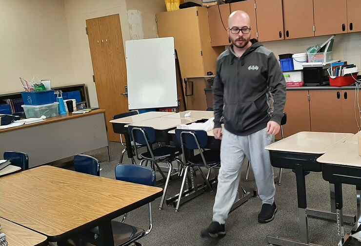 Nick Angelos prepares his classroom for the new school year.
