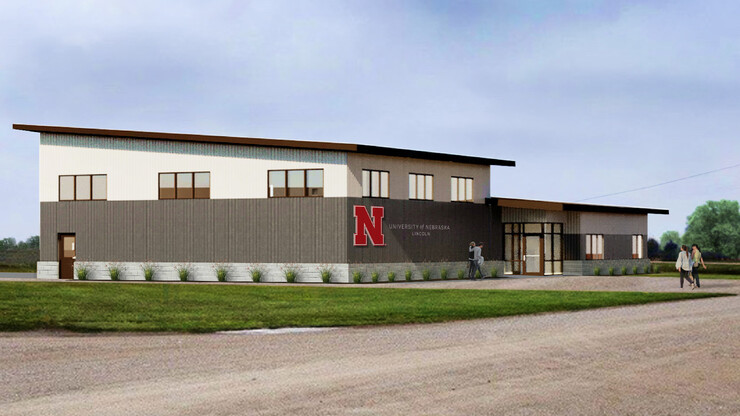 A rendering of the NFarms building, featuring a sloped roof, and the Nebraska N and "University of Nebraska–Lincoln" on the front. 
