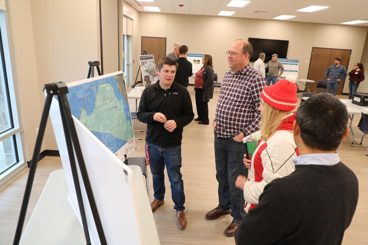 Architecture students and faculty members show their work to Fremont community members.