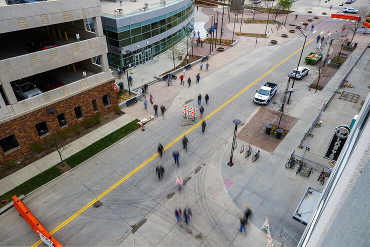 Area residents move about the Haymarket as they enter and leave Pinnacle Bank Arena during a COVID-19 vaccination clinic on April 7. More than 40,000 area residents were projected to receive the vaccine this week.