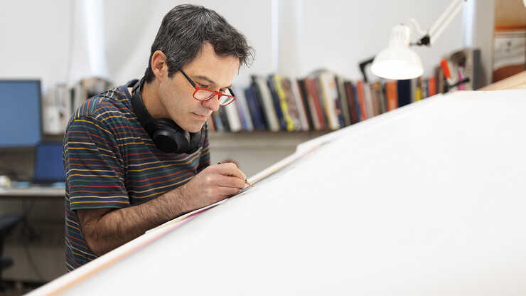 Francisco Souto works on "We Are Nebraska" in his Richards Hall studio on May 13, 2021. The 2-foot-tall by 8-foot-wide artwork took 17 months to complete.