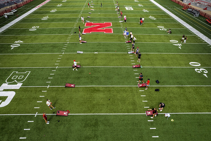 Aerial image of multiple student teams playing on the turf in Memorial Stadium.