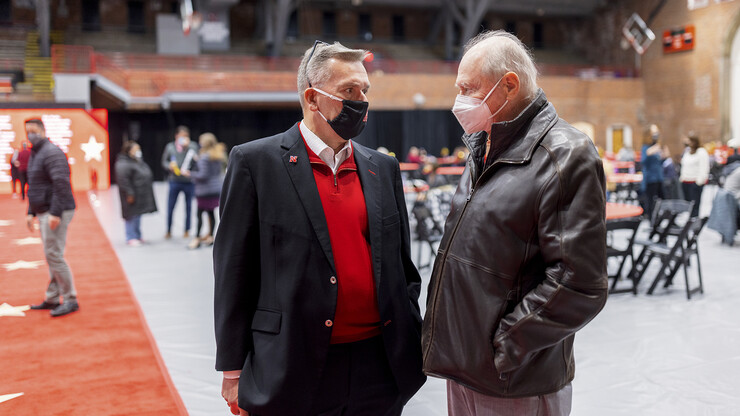 Chancellor Ronnie Green talks with James Van Etten about his 55-year career at the university during the Salute to Service on Nov. 18.