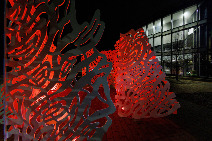 The "Reverie" sculpture by Linda Fleming reflects the spirit of Glow Big Red outside the International Quilt Museum on Feb. 16.