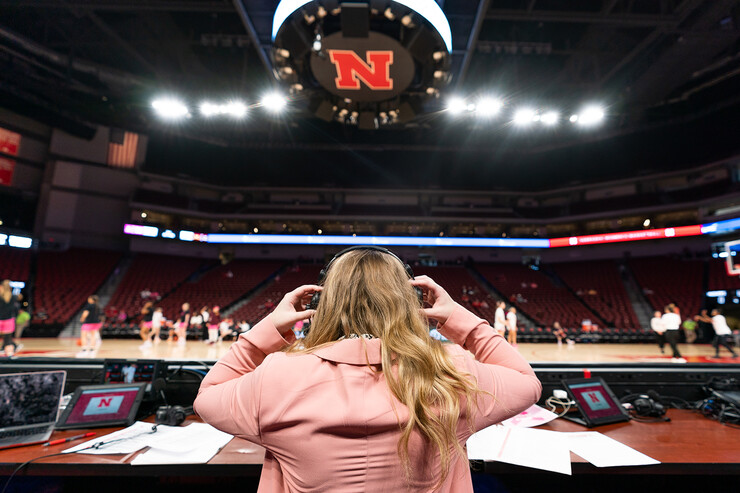 Hailey Ryerson puts on her headphones before the Husker women’s basketball game on Feb. 20.