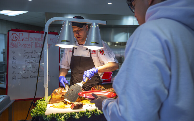 A student selects what types of beef he would like during the event at Cather Dining Center. The special meal was the first "Nebraska. Local." event hosted by Dining Services since the start of the COVID-19 pandemic.