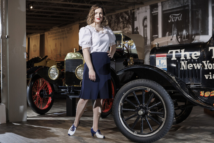 Channeling her everyday vintage inspired style, Anna Kuhlman wears this puff sleeve blouse designed by her based on late 30s and early 40s styles. Paired with navy pencil skirt and reproduction 30s shoes. She poses next to a 1924 Ford Model T at the Speedway Motors Museum of Speed.