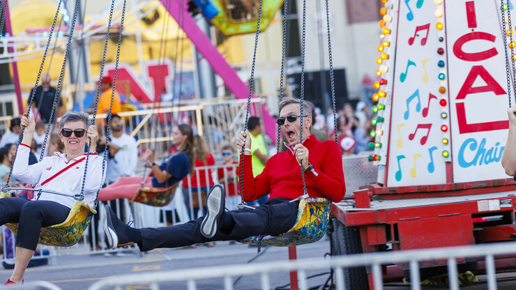 Jane and Ronnie Green went for a spin on the Musical Chairs ride during the Cornstalk homecoming celebration on the east side of Memorial Stadium on Sept. 30.